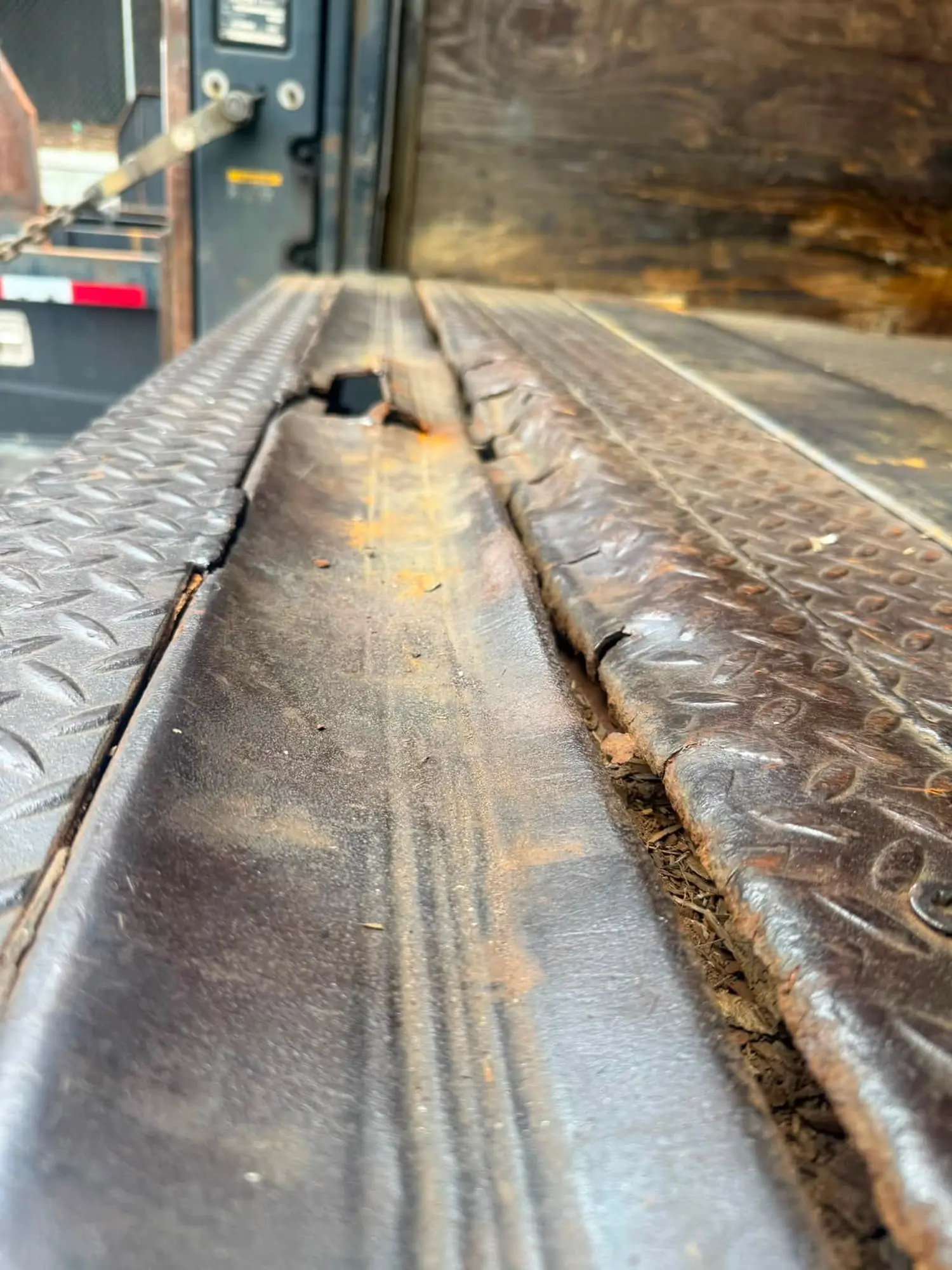 The rear threshold takes every wheel of every pallet jack that ever crossed it.